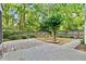 Backyard featuring a tree and a landscaped yard with a fence at 4311 Sentinel Nw Pl, Kennesaw, GA 30144