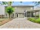 Exterior view of the home and screened in porch with a yard covered in pavers at 4311 Sentinel Nw Pl, Kennesaw, GA 30144