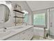 Well-lit bathroom with double sinks, granite countertops, shelves, and a soaking tub at 4311 Sentinel Nw Pl, Kennesaw, GA 30144