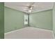 Empty bedroom with neutral walls, plush carpeting, a ceiling fan and window views at 4311 Sentinel Nw Pl, Kennesaw, GA 30144