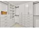 Spacious walk-in closet featuring custom shelving, drawers, and ample storage space at 4311 Sentinel Nw Pl, Kennesaw, GA 30144