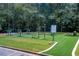 Outdoor community exercise area with various exercise machines and lush landscaping at 4311 Sentinel Nw Pl, Kennesaw, GA 30144