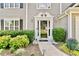 Elegant front entrance with decorative trim, well-maintained landscaping, and exterior lighting at 4311 Sentinel Nw Pl, Kennesaw, GA 30144