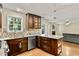 Spacious kitchen with stainless steel appliances, granite countertops, and a view of the living room at 4311 Sentinel Nw Pl, Kennesaw, GA 30144