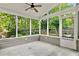 Spacious screened porch with lush green backyard views, offering an ideal spot for relaxation at 4311 Sentinel Nw Pl, Kennesaw, GA 30144