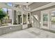 Enclosed porch with concrete flooring that leads to an outdoor space and another room at 4311 Sentinel Nw Pl, Kennesaw, GA 30144