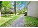 Gravel path leads through the backyard to a charming fire pit and swing set area, perfect for relaxation at 4330 Volnay Ne Ct, Marietta, GA 30066