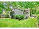 Lush backyard with a well-maintained lawn, landscaping, and patio for enjoying the outdoors at 4330 Volnay Ne Ct, Marietta, GA 30066