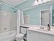 Bright bathroom with a bathtub, toilet, and white vanity with sink at 4330 Volnay Ne Ct, Marietta, GA 30066