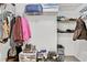 Well-organized closet with clothes, shoes, and storage bins on shelves at 4330 Volnay Ne Ct, Marietta, GA 30066