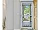 The view out of the clear glass storm door shows the walkway and exterior at 4330 Volnay Ne Ct, Marietta, GA 30066