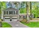 Charming two-story home with a two-car garage and inviting front porch nestled among mature trees at 4330 Volnay Ne Ct, Marietta, GA 30066