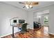 Home office with hardwood floors, natural lighting, and an adjacent sitting room at 4330 Volnay Ne Ct, Marietta, GA 30066