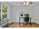 Bright home office with natural light, hardwood floors, and a view of the trees at 4330 Volnay Ne Ct, Marietta, GA 30066