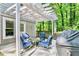 Outdoor patio features seating beneath a pergola, perfect for entertaining and enjoying nature at 4330 Volnay Ne Ct, Marietta, GA 30066