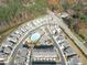 A high angle of the community with a pool and green space surrounded by light and airy houses at 1309 Bennett Creek Ovlk, Suwanee, GA 30024