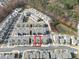 Aerial view of a grey townhome with a red box surrounding it, surrounded by similar townhomes at 1309 Bennett Creek Ovlk, Suwanee, GA 30024