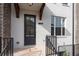 Welcoming entryway with address display, sleek black door, and brick steps leading to the entrance at 1309 Bennett Creek Ovlk, Suwanee, GA 30024