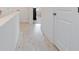A hallway featuring hard-wood flooring and white walls at 1309 Bennett Creek Ovlk, Suwanee, GA 30024