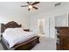 Main bedroom with neutral carpet, white walls, a ceiling fan, and easy access to an ensuite bathroom at 1309 Bennett Creek Ovlk, Suwanee, GA 30024