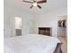 Main bedroom featuring a ceiling fan and easy access to an ensuite bathroom and walk-in closet at 1309 Bennett Creek Ovlk, Suwanee, GA 30024