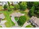 Overhead view captures a well-landscaped yard with green lawn surrounding the house and driveway at 2139 Bramlett Nw Pl, Marietta, GA 30064