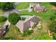Aerial view showcasing lush landscaping, a stone patio, a pool, and a well-maintained home with a spacious, green lawn at 2139 Bramlett Nw Pl, Marietta, GA 30064