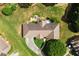 Overhead view of a well-kept home featuring a stone patio, a pool and lush landscaping, surrounded by a spacious green lawn at 2139 Bramlett Nw Pl, Marietta, GA 30064