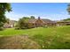 Expansive backyard featuring a brick house with a chimney and a lush green lawn at 2139 Bramlett Nw Pl, Marietta, GA 30064