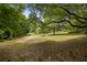 Vast backyard with mature trees offering shade and privacy, perfect for outdoor activities and relaxation at 2139 Bramlett Nw Pl, Marietta, GA 30064
