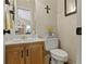 Cozy powder room with vanity, toilet, and decorative accents at 2139 Bramlett Nw Pl, Marietta, GA 30064