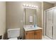Cozy bathroom featuring single sink vanity and a glass door shower at 2139 Bramlett Nw Pl, Marietta, GA 30064