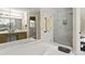 Bright bathroom featuring jacuzzi tub, glass door shower, and double sink at 2139 Bramlett Nw Pl, Marietta, GA 30064