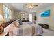 Cozy bedroom with tray ceiling, ceiling fan, and large picture window at 2139 Bramlett Nw Pl, Marietta, GA 30064