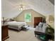 Spacious bedroom with vaulted ceiling, soft carpet, and a comfy seating area at 2139 Bramlett Nw Pl, Marietta, GA 30064