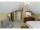 Upstairs bedroom featuring neutral walls, sloped ceiling, and hardwood dresser at 2139 Bramlett Nw Pl, Marietta, GA 30064