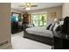 Comfortable bedroom featuring a ceiling fan, dresser, and natural light from the windows overlooking the yard at 2139 Bramlett Nw Pl, Marietta, GA 30064