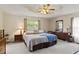 Primary bedroom featuring a ceiling fan and a large window for natural light at 2139 Bramlett Nw Pl, Marietta, GA 30064