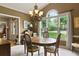 Elegant dining room featuring a chandelier, large windows, and neutral wall colors for a sophisticated ambiance at 2139 Bramlett Nw Pl, Marietta, GA 30064