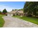 Charming home with stone accents, a two-car garage, and a well-manicured lawn, offering great curb appeal at 2139 Bramlett Nw Pl, Marietta, GA 30064