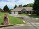 Charming single-story home boasts a stone facade, a two-car garage, and a well-manicured front yard at 2139 Bramlett Nw Pl, Marietta, GA 30064