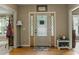 Welcoming foyer with hardwood floors, a decorative front door with sidelights, and neutral wall colors at 2139 Bramlett Nw Pl, Marietta, GA 30064