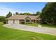 Charming home featuring a stone facade, well-manicured lawn, and an attached two car garage at 2139 Bramlett Nw Pl, Marietta, GA 30064
