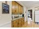 Close-up of the kitchen's counter and cabinets, including granite countertops and a 'Season Everything with Love' sign at 2139 Bramlett Nw Pl, Marietta, GA 30064