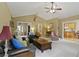 Spacious living room with neutral carpet, vaulted ceiling, and views of the entryway and kitchen at 2139 Bramlett Nw Pl, Marietta, GA 30064