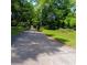 Street view of vacant lot offering potential for new construction in established neighborhood with mature trees at 2637 Johnson St, Lithonia, GA 30058