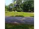 Street view of vacant lot providing an opportunity to build your home in a neighborhood with mature trees at 2637 Johnson St, Lithonia, GA 30058