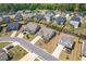 Gorgeous aerial view of a community with beautiful homes and lush landscaping at 3715 Bridges Ct, Cumming, GA 30040