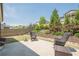 Backyard patio with landscaped greenery and a wooden fence at 3715 Bridges Ct, Cumming, GA 30040
