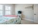 Comfortable bedroom featuring a bed, a TV and natural light from windows at 3715 Bridges Ct, Cumming, GA 30040